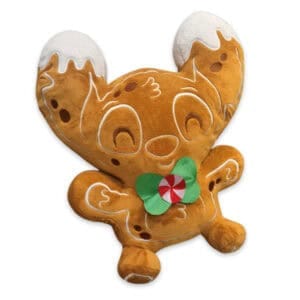 Stitch knuffel als peperkoekmannetje, zittend, in bruine kleur met witte glazuurdetails en een lachende uitdrukking. Disney Lilo & Stitch thema.